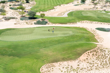 View from above people playing golf