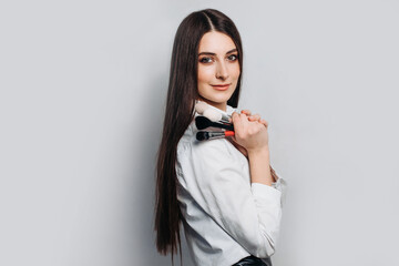 Makeup artist with brushes in hand on a white background