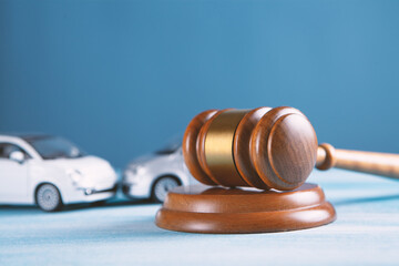 Model of car and gavel. Accident lawsuit or insurance, court case.