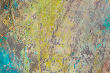 Obraz na płótnie Canvas colorful creative motley background: smudged residues of oil paints on a wooden palette, short focus, selective blur