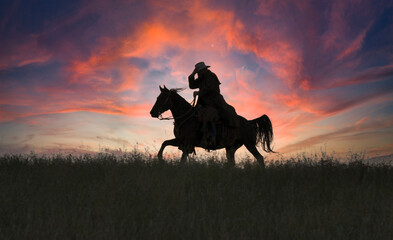 Cowboy silhouette  gallop at dawn