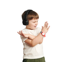 isolated child in headphones listens to music and sings on white background. happy little boy. cross arms.