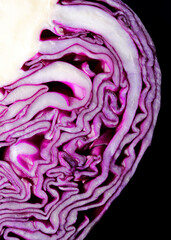 close-up red cabbage on black background