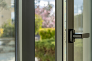 Aluminum window open detail. Metal door frame closeup view. © Rawf8
