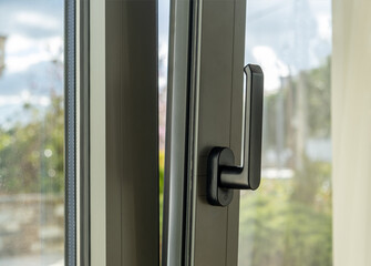 Aluminum window open detail. Metal door frame closeup view. © Rawf8