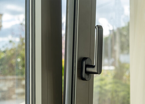 Aluminum window open detail. Metal door frame closeup view.