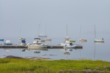 USA, Massachusetts, Cape Ann, Gloucester. Annisquam Harbor, boats in fog