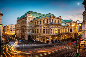 Fototapeta na wymiar Vienna State Opera. Veinna, Austria. Evening view. The historic opera house is a symbol and landmark of the city of Vienna. Panoramic view, long exposure.