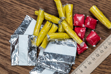 evidence of smuggling traffic: packages of unknown drugs next to the forensic scale