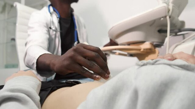 Doctor do ultrasound devices monitor diagnostic to a woman patient. Sonography.