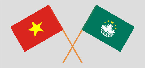 Crossed flags of Vietnam and Macau. Official colors. Correct proportion