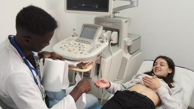 Doctor do ultrasound devices monitor diagnostic to a woman patient. Sonography.
