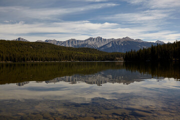 Fototapeta na wymiar Mountain silhouette reflected in the water