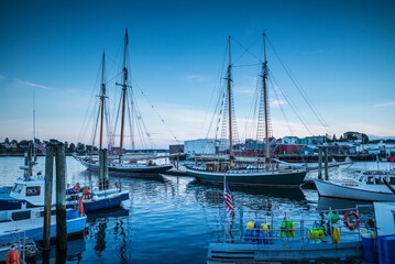 USA, Massachusetts, Cape Ann, Gloucester. Gloucester Schooner Festival, schooners at dusk