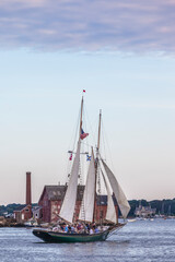 USA, Massachusetts, Cape Ann, Gloucester. Gloucester Schooner Festival, schooners in Gloucester Harbor at dusk