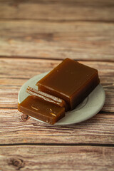 apple marmalade on a plate on a wooden table background