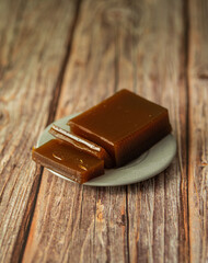 apple marmalade on a plate on a wooden table background