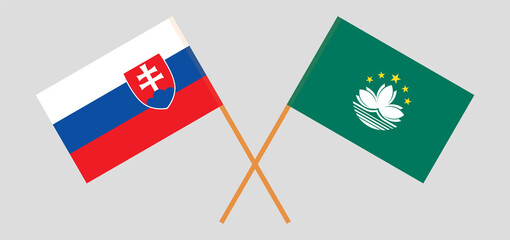 Crossed flags of Slovakia and Macau. Official colors. Correct proportion