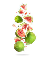 Whole and sliced ripe green figs in the air on a white background