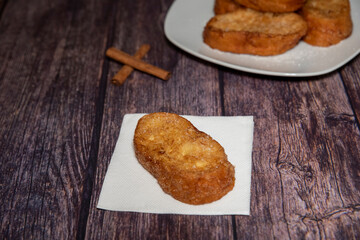 French toasts on a wooden plate. A delicious meal.