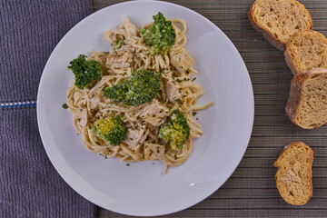 Rich breakfast of spaghetti with broccoli and chicken