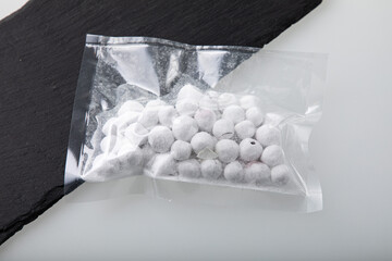 Cranberries in powder sugar packed in vacuum sealed plastic bag