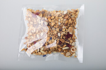 Granola with nuts in vacuum sealed plastic packaging