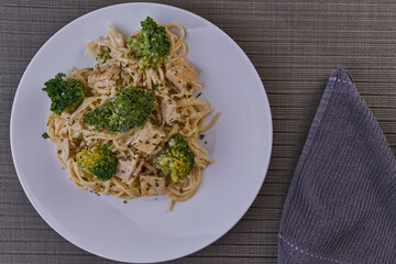 Rich breakfast of spaghetti with broccoli and chicken