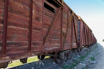 Fototapeta na wymiar Vintage wooden train wagons. Soviet style freight trains. Retro style