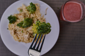 Rich breakfast of spaghetti with broccoli and chicken