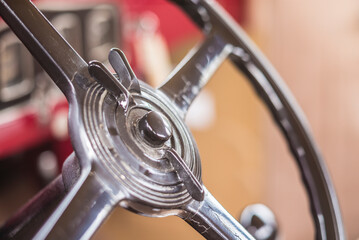 USA, Massachusetts, Essex. Antique cars, detail of 1920's-era steering wheel mounted throttle