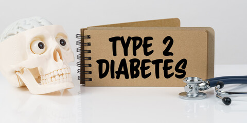 On the table lies a skull, a stethoscope and a notebook with the inscription - TYPE 2 DIABETES