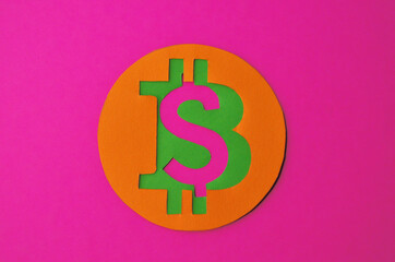 Bitcoin is connected to the dollar on a pink background horizontal orientation. Conceptual collage about cryptocurrency in the power of minimalism. High quality photo