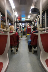 view inside a city bus with people
