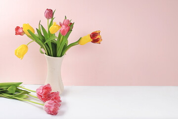 Holiday concept with flowers, spring or summer composition, still life with tulips in a vase, banner. Greeting card for mothers day, womens day, lovers day, happy birthday, wedding, selective focus