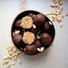 Chocolate home made energy balls. Healthy sweets. Home cooking. Vegetarian diet. Brown backgroung.
