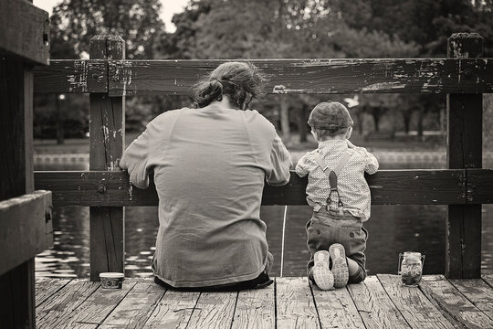 Father And Son On A Dock Fishing