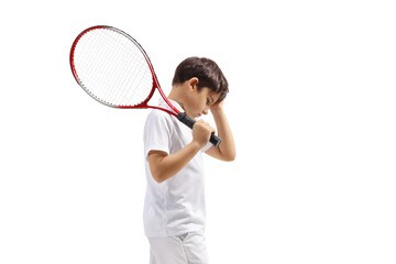 Disappointed boy with a tennis racquet