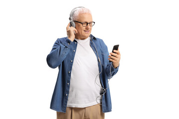 Mature man listening to music with headphones and mobile phone