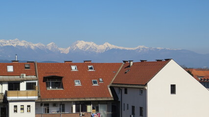 House roof with fantastic scenery white mountains in Ljubljana