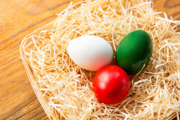 Easter eggs as the color of the Italian flag - green, white, red. Happy Easter holiday card