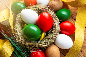 Fototapeta na wymiar Easter eggs as the color of the Italian flag - green, white, red. Happy Easter holiday card