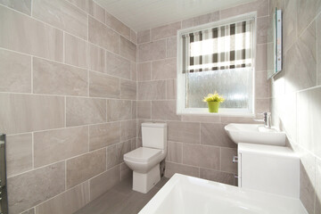 modern style marble tiled bathroom in summer time