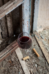 A glass of red wine on an old window