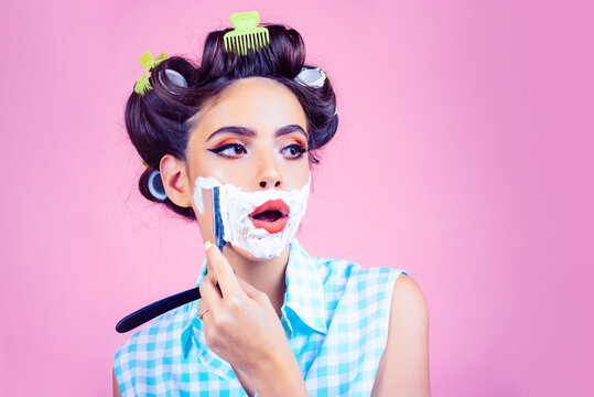 Funny girl barber. Morning woman shaving face with foam and razor blade, copy space. Facial care. Laser hair removal.