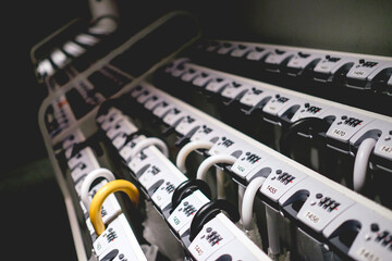 Umbrella holder with key and numbers with some umbrellas, Japan