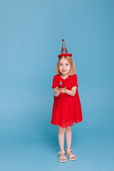 little girl on her birthday with a cake