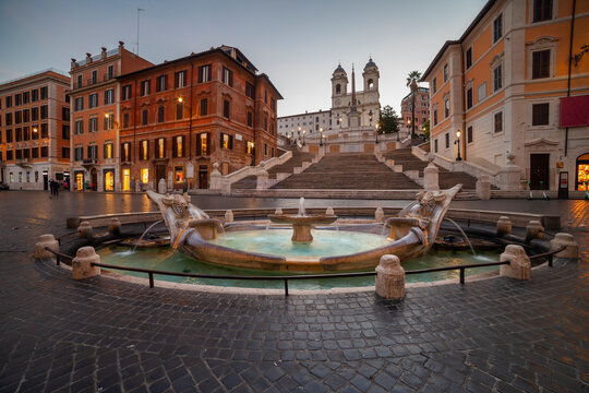 Italy, Rome, Spanish Steps, Piazza di Spagna, Barcaccia Fountain, Fountain on town square at dawn