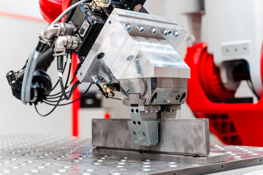 Close-up of automatic industrial welding robot in factory
