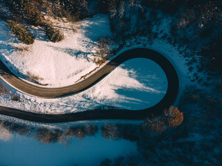 Aerial view of hairpin curve of empty alpine road, Germany